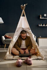 Happy businessman working laptop in home tent © Nomad_Soul