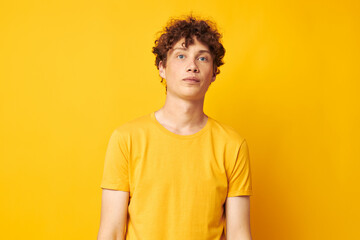 Young curly-haired man Youth style studio casual wear isolated background unaltered