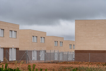 Fototapeta na wymiar Contemporary row houses with brick facade in Spain