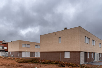 Fototapeta na wymiar Contemporary row houses with brick facade in Spain