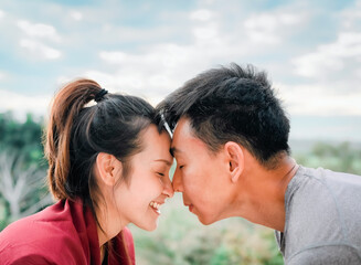 Side view of young couple face touching and smile, concept of couple relationship and valentine