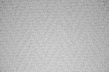 The texture or background of the wall of the room has a gray pattern.