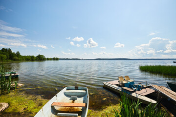 Naklejka na ściany i meble Boat and catamaran on the lake in summer 