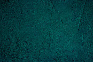 Petrol colored wall background with textures of different shades of teal