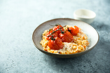 Fototapeta na wymiar Risotto with tomatoes and cheese