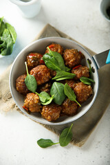Homemade meatballs with fresh spinach