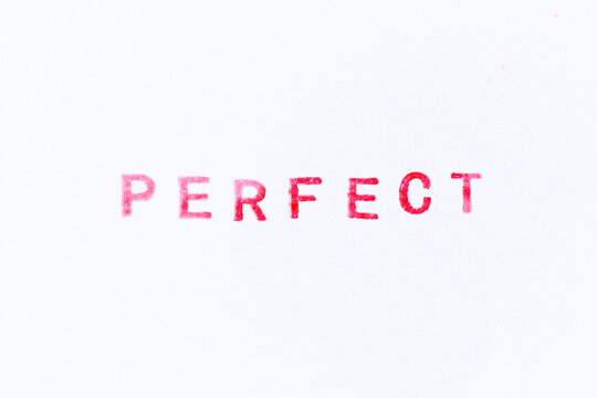 Red color ink rubber stamp in word perfect on white paper background