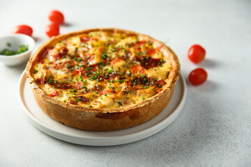 Homemade chicken quiche with tomatoes and pepper