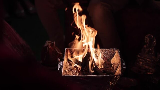 Slow Motion shot of Fire,Agni havan kund,Indian Havan Kund, rituals of hindus yagya at an Indian Wedding Function in New Delhi,India
