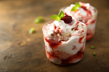 Homemade meringue dessert with raspberry and cream