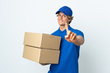 Delivery man over isolated white background showing and lifting a finger