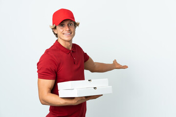 pizza delivery man over isolated white background extending hands to the side for inviting to come