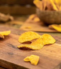 potato chips and beer on wooden background in a cafe, pub or at home
