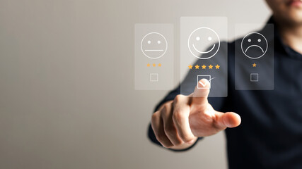 Customer service satisfaction survey concept, business people or customers express their satisfaction through applications on the tablet screen. By giving me the most satisfaction rating of 5 stars.