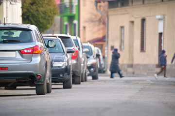 City traffic with cars parked in line on street side