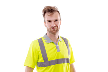 A middle-aged white man wearing a green uniform t-shirt standing over an isolated white background. He looks happy and smiles, a smirk on his face. Worker and builder concept.