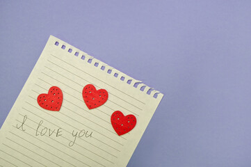 a piece of paper with the inscription I love you and 3 heart