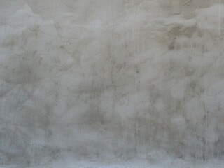 Concrete gray wall. Fragment of old plaster. Rough texture