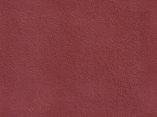 Rough surface. Concrete wall painted with red paint. building texture