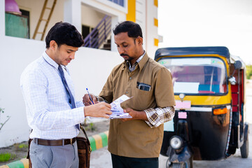 auto driver signing on insurance agreement or mortgage paper in front of rikshaw - concept approval of vehical or personal loan, self employment and financial support. - obrazy, fototapety, plakaty