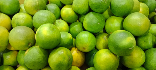 A pile of sweet lime which is also called as citrus limetta or mosambi