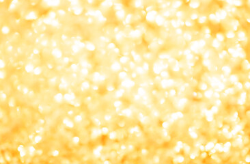 Blurred festive golden background. Bokeh background of yellow Christmas sparkles. Beautiful Christmas decoration of the interior of the house.
