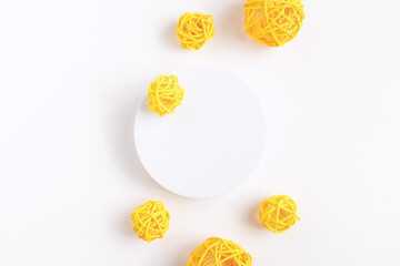 Podium for cosmetic product presentation. Abstract minimal form with geometrical form. Cylinder podium with rattan balls. Scene to show products. Showcase, display case. Flat lay, top view.