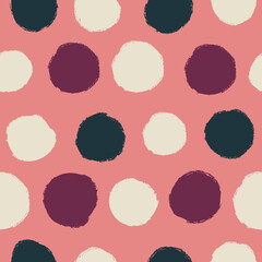 Seamless pattern with polka dots on a pink background.