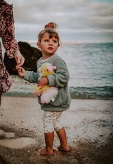 little child on the beach in lagos algarve portugal 