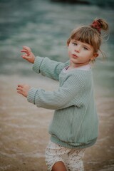 little child on the beach in lagos algarve portugal 