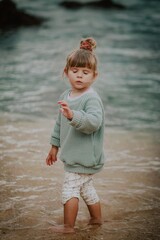 Fototapeta na wymiar little child on the beach in lagos algarve portugal 