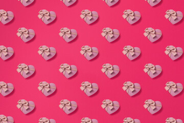 Seamless Pattern of paper hearts on pink background. Top view, flat lay . Love concept.