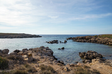 Fototapeta na wymiar Cala Turqueta, Menorca. September 2021. Paradise beach on the island of Menorca. Perfect place to relax and enjoy nature in summer.