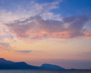 sea bay with mountain silhouette at the evening