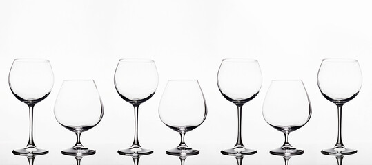 Empty wine glasses on a white background. beautiful still life
