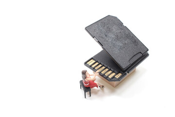 a mini figure play the SD card Grand Piano