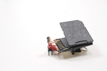 a mini figure play the SD card Grand Piano