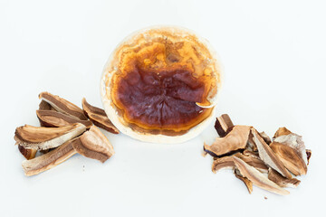 Pile of slice Dried Ganoderma Lucidum Mushroom isolated on white background. Ling Zhi Mushroom