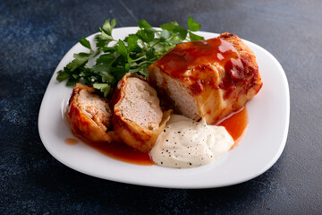 Cabbage rolls stuffed with mince beef, rice, tomato sauce and sour cream