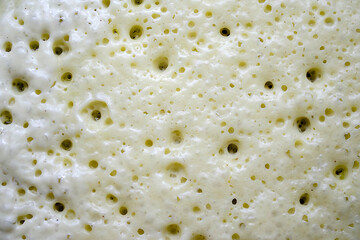 Close-up view of crepes dough, pancakes during the cooking process