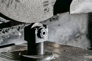 Abrasive grinding stone on a surface grinder with the correct cone installed before cleaning the...