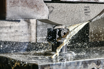 Editing of abrasive stone with a diamond cutter on a water-cooled surface grinder.