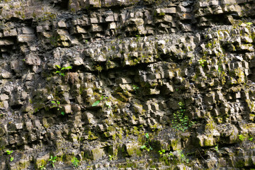 granite texture in outdoor nature. natural wall of rock in day light. abandoned quarry