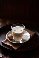 Coffee with milk on dark background. Soft focus. Copy space.	