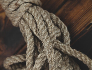 Fototapeta premium Braided thick rope tied in a skein. Hemp rope for decoration and design. 