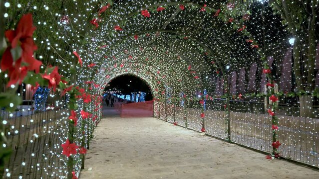 Tunnel with beautiful Christmas decorations in downtown at night 