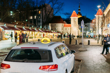 Tallinn, Estonia. Taxi Car Parking Near Viru Gates Entrance To Old Part Town Estonian Capital....