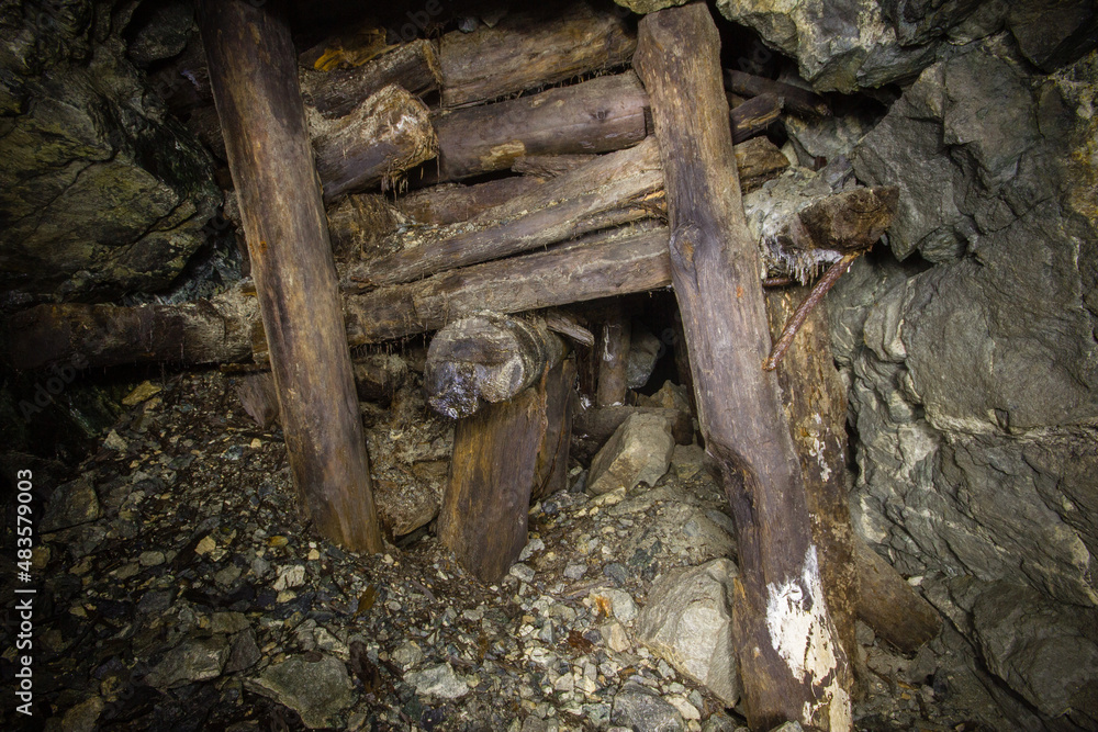 Poster underground gold mine tunnel with wooden timbering