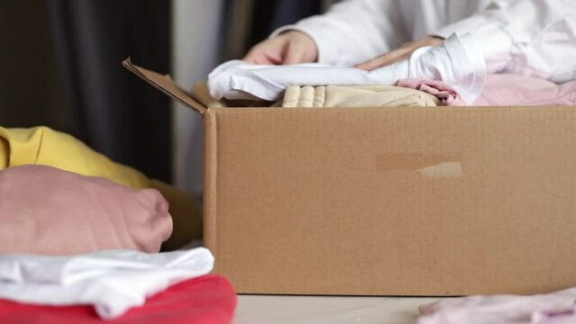 online delivery of clothes on customer orders, fashion items in a parcel in a box on the table