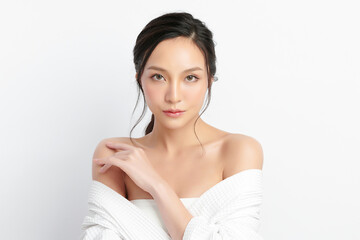 Beautiful young Asian woman wearing bathrobe on white background, Face care, Facial treatment, Cosmetology, beauty and spa Concept.